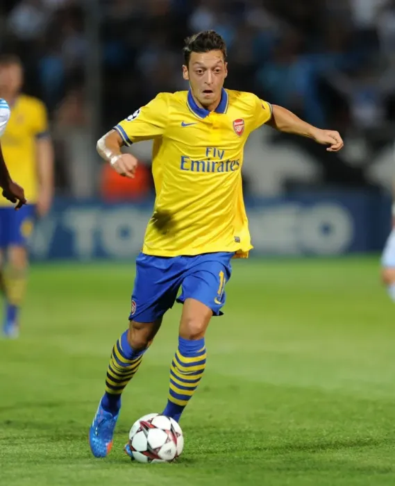 Framed Print : Mesut Ozil: Arsenal Star in Action against Olympique Marseille (2013-14 UEFA Champions League)