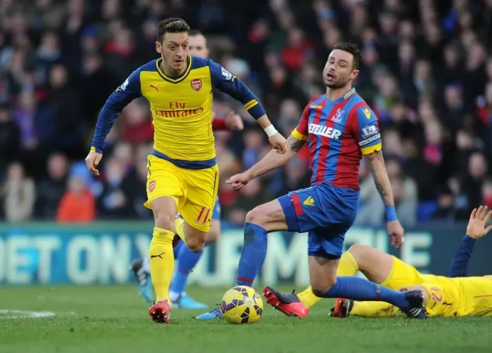 Framed Print : Mesut Ozil Breaks Past Crystal Palace's Damien Delaney during Arsenal's Premier League Victory Framed Print : Mesut Ozil Breaks Past Crystal Palace's Damien Delaney during Arsenal's Premier League Victory