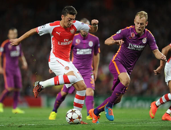 Mesut Ozil Breaks Past Galatasaray's Samih Kaya in Arsenal's 2014 / 15 Champions League Clash