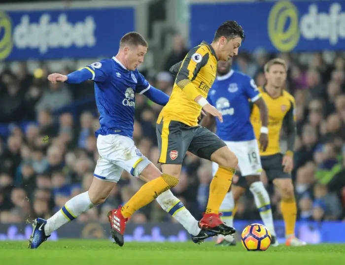 Framed Print : Mesut Ozil Breaks Past McCarthy: Everton vs Arsenal, Premier League 2016-17