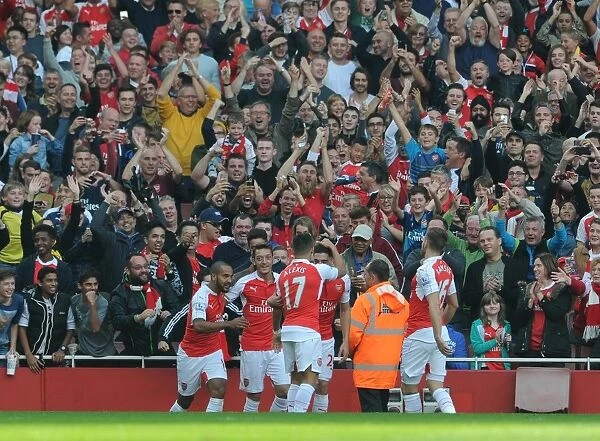 Mesut Ozil celebrates Arsenals 2nd goal with his team mates