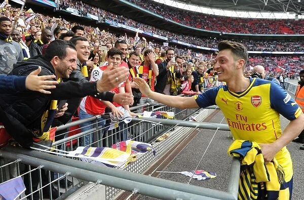 Mesut Ozil Celebrates FA Cup Victory with Arsenal Fans