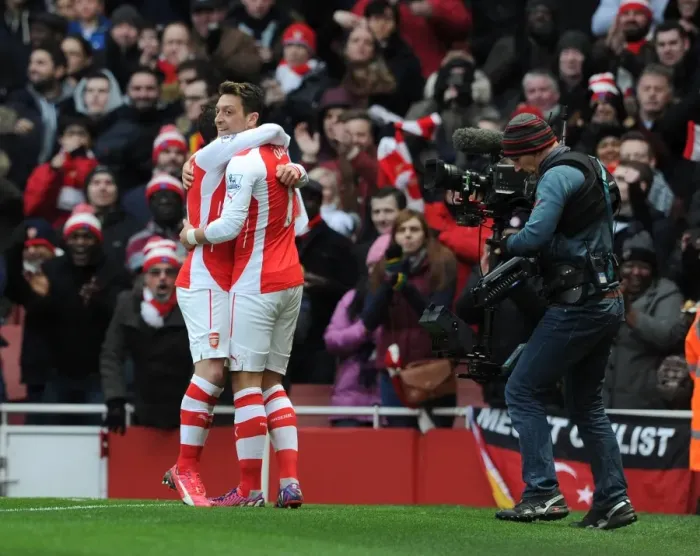 Framed Print : Mesut Ozil celebrates scoring Arsenals 2nd goal with Santi Cazorla. Arsenal 5: 0 Aston Villa