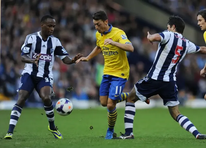 Framed Print : Mesut Ozil Clashes with Claudio Yacob and Saido Berahino during West Bromwich Albion vs Arsenal, Premier League 2013-14