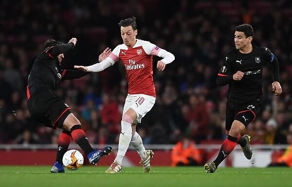 Mesut Ozil Clashes with Clement Grenier and Benjamin Andre in Arsenal's Europa League Showdown against Stade Rennais