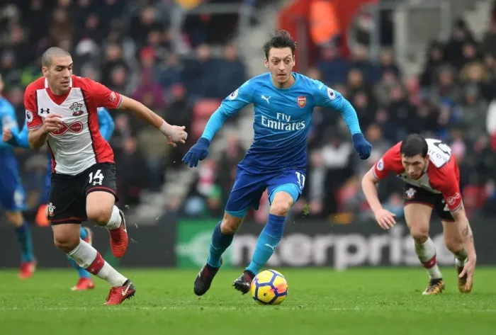 Framed Print : Mesut Ozil Clashes with Hojbjerg and Romeu in Southampton vs Arsenal Premier League Showdown