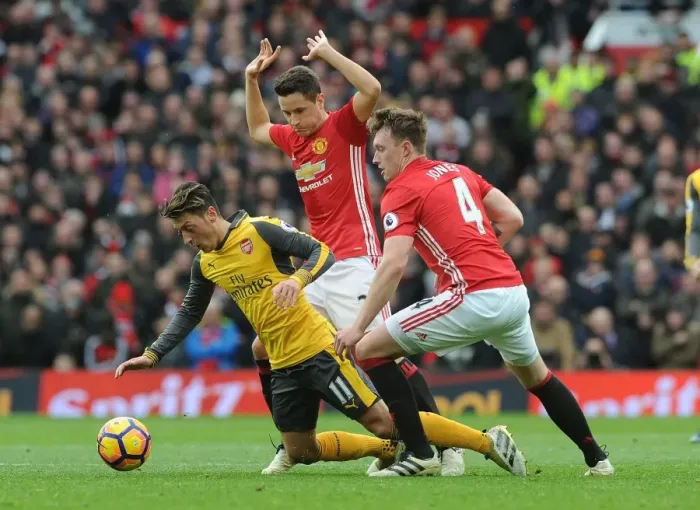 Framed Print : Mesut Ozil Clashes with Manchester United's Ander Herrera and Phil Jones during the Intense 2016-17 Premier League Match