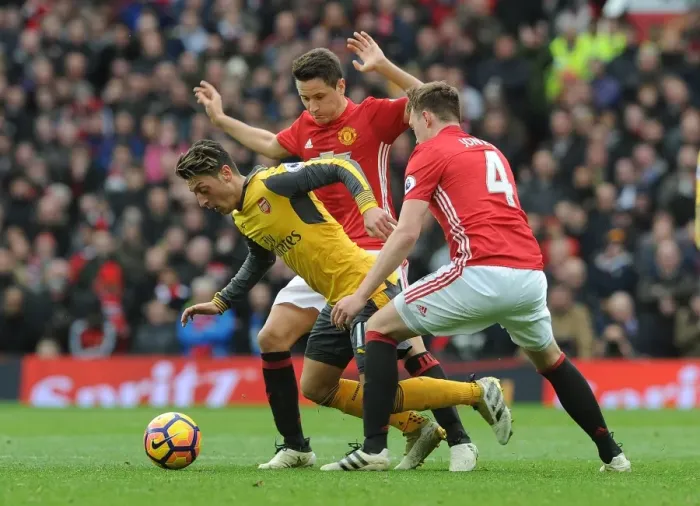 Framed Print : Mesut Ozil Clashes with Manchester United's Herrera and Jones during the 2016-17 Premier League Match Framed Print : Mesut Ozil Clashes with Manchester United's Herrera and Jones during the 2016-17 Premier League Match