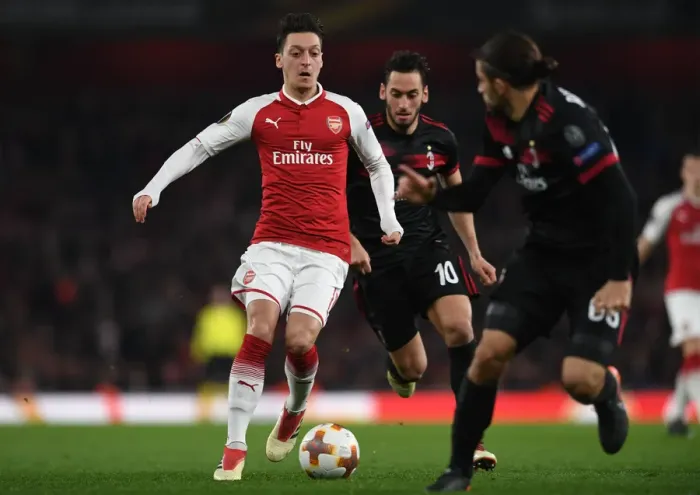 Framed Print : Mesut Ozil Clashes with Ricardo Rodriguez and Hakan Calhanoglu in Arsenal vs AC Milan UEFA Europa League Showdown