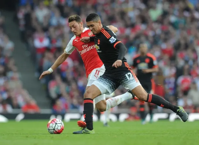 Framed Print : Mesut Ozil Closes Down Chris Smalling in Intense Arsenal vs Manchester United Clash