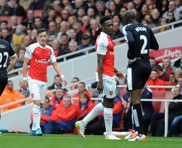 Mesut Ozil in Deep Chat with Allan Nyom during Arsenal vs. Watford, Premier League 2015-16