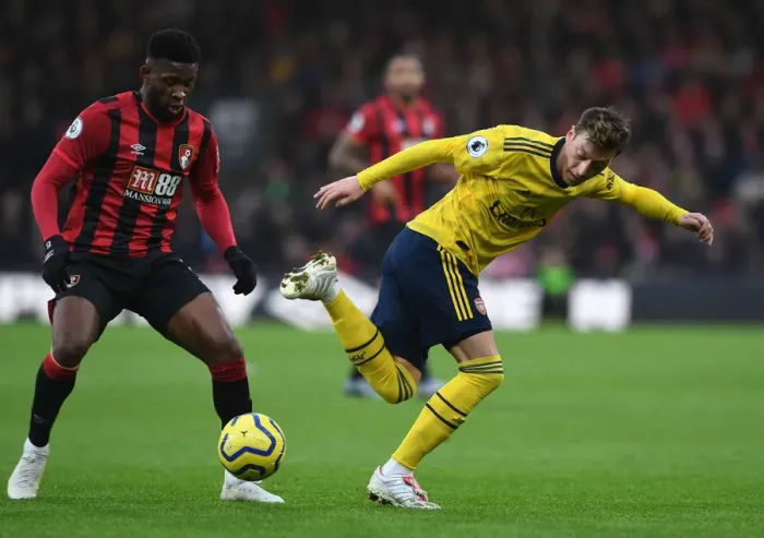 Framed Print : Mesut Ozil Evades Jefferson Lerma: AFC Bournemouth vs. Arsenal FC, Premier League (December 2019)