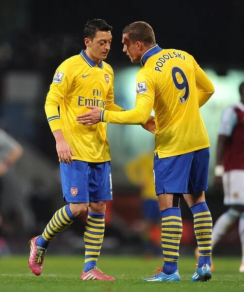 Mesut Ozil and Lukas Podolski (Arsenal). West Ham United 1:3 Arsenal. Barclays Premier League