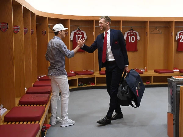 Mesut Ozil and Per Mertesacker in Arsenal Changing Room Before Arsenal v Burnley Match, 2018