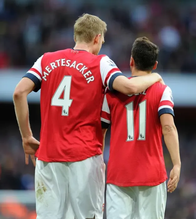 Framed Print : Mesut Ozil and Per Mertesacker Celebrate Arsenal's Victory: Arsenal v Norwich City, 2013-14 Framed Print : Mesut Ozil and Per Mertesacker Celebrate Arsenal's Victory: Arsenal v Norwich City, 2013-14