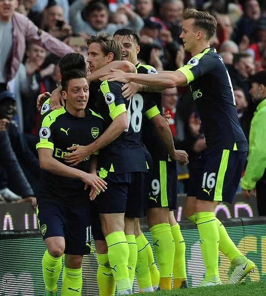 Mesut Ozil, Monreal, Xhaka, and Holding Celebrate Arsenal's Goals Against Stoke City