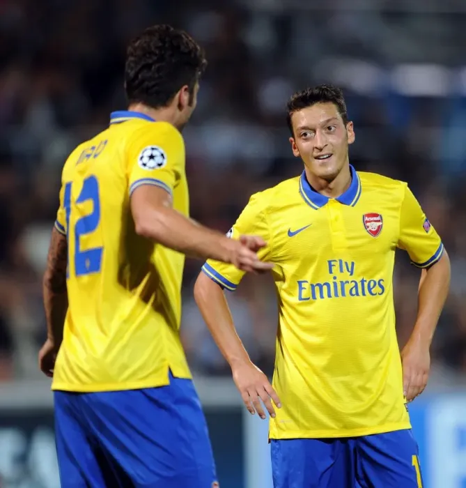 Framed Print : Mesut Ozil and Olivier Giroud: Arsenal's Dynamic Duo in Action against Olympique de Marseille, UEFA Champions League, 2013