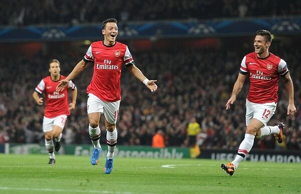 Mesut Ozil and Olivier Giroud Celebrate Arsenal's First Goal Against Napoli in the 2013-14 UEFA Champions League