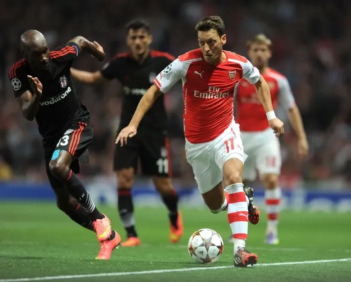 Framed Print : Mesut Ozil Outmaneuvers Atiba Hutchinson: Arsenal FC vs Besiktas JK, UEFA Champions League Qualifiers (2014) Framed Print : Mesut Ozil Outmaneuvers Atiba Hutchinson: Arsenal FC vs Besiktas JK, UEFA Champions League Qualifiers (2014)