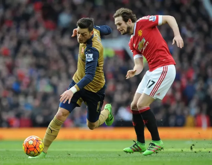 Framed Print : Mesut Ozil Outmaneuvers Daley Blind: Premier League Showdown between Manchester United and Arsenal (2015 / 16)