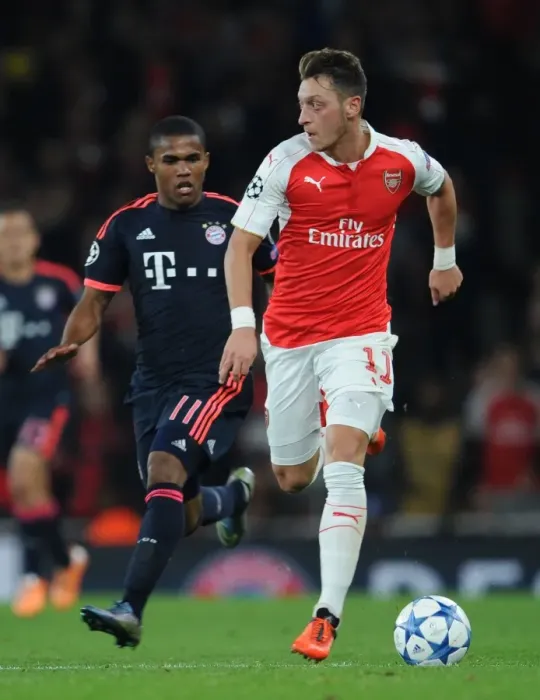 Framed Print : Mesut Ozil Outmaneuvers Douglas Costa: Arsenal FC vs. FC Bayern Munich, UEFA Champions League, 2015