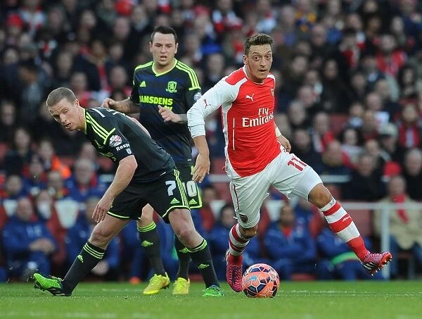 Mesut Ozil Outmaneuvers Grant Leadbitter in FA Cup Clash: Arsenal vs. Middlesbrough