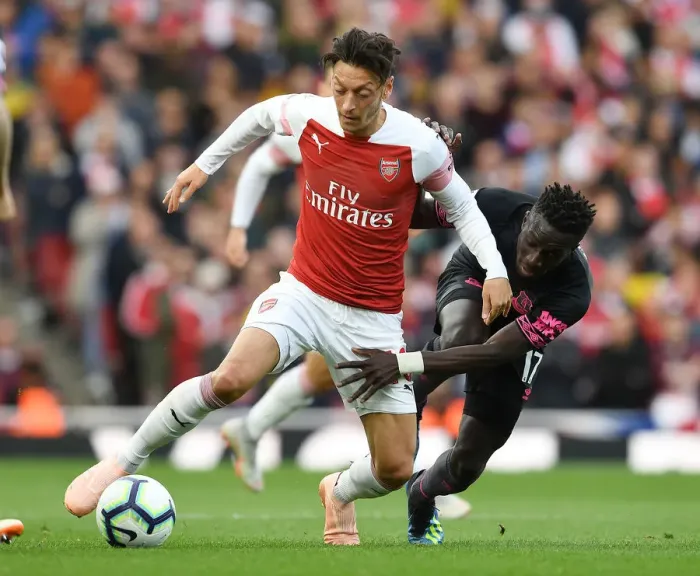 Framed Print : Mesut Ozil Outmaneuvers Idrissa Gueye in Arsenal's Premier League Clash Framed Print : Mesut Ozil Outmaneuvers Idrissa Gueye in Arsenal's Premier League Clash