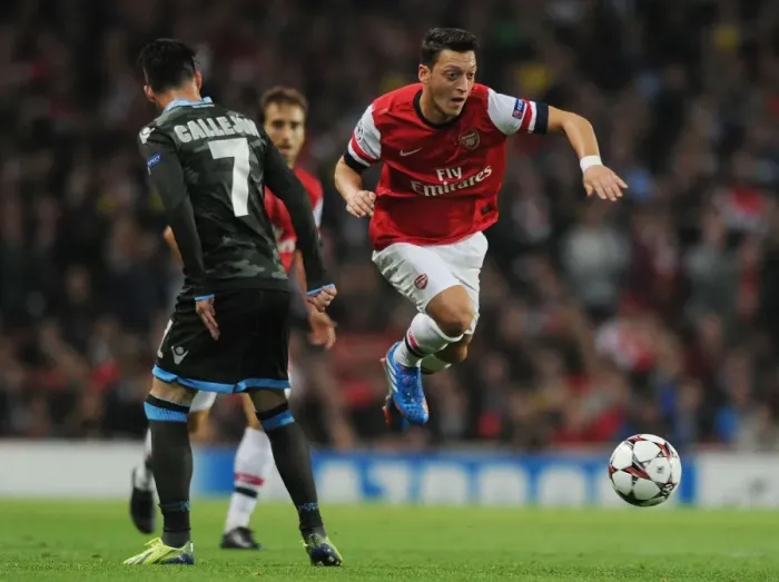 Framed Print : Mesut Ozil Outmaneuvers Jose Callejon in Arsenal's UEFA Champions League Clash
