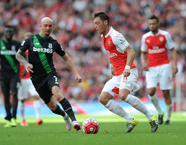 Mesut Ozil Outmaneuvers Stephen Ireland: Arsenal's Triumph Over Stoke City, 2015-16 Premier League