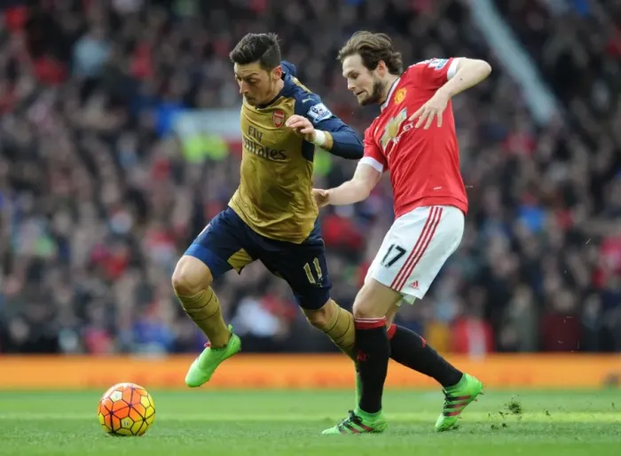 Framed Print : Mesut Ozil Outsmarts Daley Blind: Premier League Clash between Arsenal and Manchester United (2015 / 16)