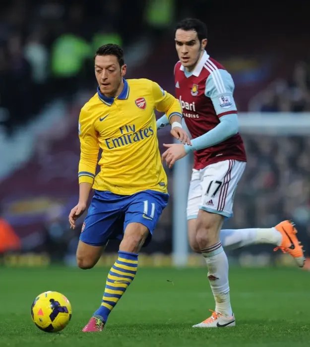 Framed Print : Mesut Ozil Outwits Joey O'Brien: Premier League Showdown between Arsenal and West Ham, 2013 Framed Print : Mesut Ozil Outwits Joey O'Brien: Premier League Showdown between Arsenal and West Ham, 2013