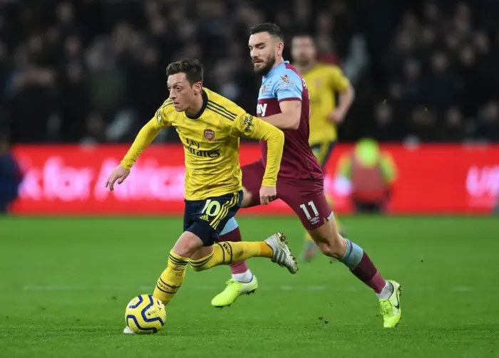 Framed Print : Mesut Ozil Under Pressure: West Ham vs. Arsenal, Premier League 2019-20: A Battle at London Stadium Framed Print : Mesut Ozil Under Pressure: West Ham vs. Arsenal, Premier League 2019-20: A Battle at London Stadium
