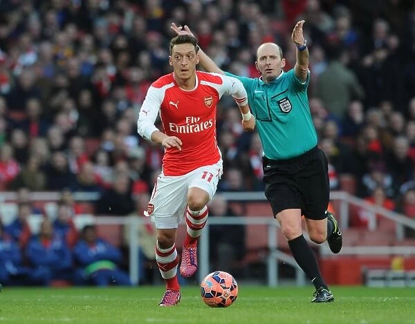 Mesut Ozil and Referee Mike Dean during Arsenal vs. Middlesbrough FA Cup Clash