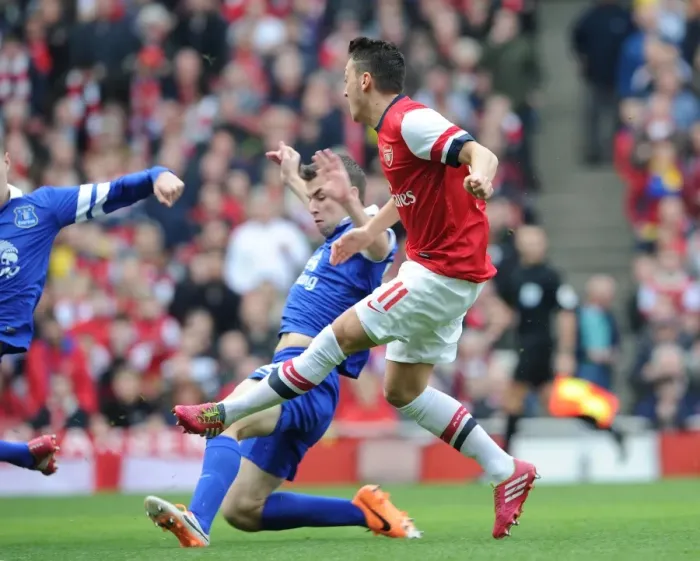 Framed Print : Mesut Ozil score Arsenals 1st goal past Seamus Coleman (Everton). Arsenal 4: 1 Everton Framed Print : Mesut Ozil score Arsenals 1st goal past Seamus Coleman (Everton). Arsenal 4: 1 Everton