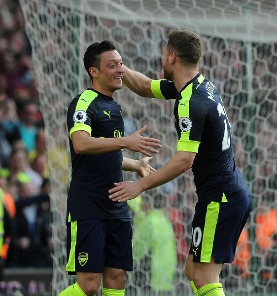 Mesut Ozil and Shkodran Mustafi Celebrate Arsenal's Second Goal Against Stoke City
