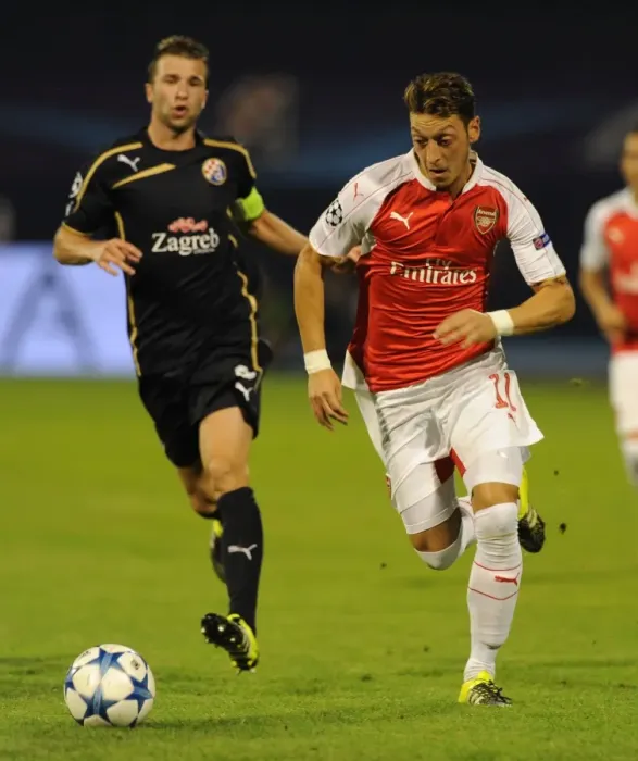 Framed Print : Mesut Ozil Slices Through Dinamo Zagreb's Defense in UEFA Champions League Showdown Framed Print : Mesut Ozil Slices Through Dinamo Zagreb's Defense in UEFA Champions League Showdown