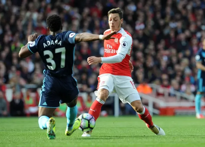 Framed Print : Mesut Ozil vs Adama Traore: Intense Battle at Emirates Stadium (Arsenal v Middlesbrough, 2016-17)