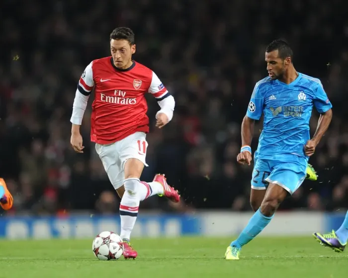 Framed Print : Mesut Ozil vs. Alaixys Romao: Arsenal vs. Marseille, UEFA Champions League, 2013