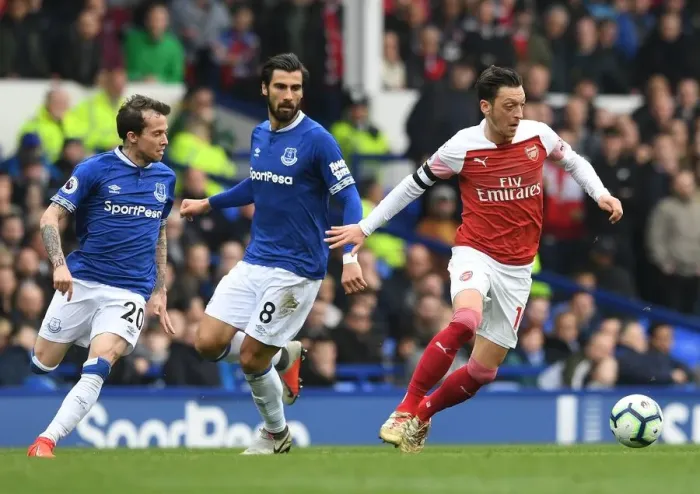 Framed Print : Mesut Ozil vs. Andre Gomes & Bernard: Intense Rivalry Unfolds in Everton vs. Arsenal Premier League Clash Framed Print : Mesut Ozil vs. Andre Gomes & Bernard: Intense Rivalry Unfolds in Everton vs. Arsenal Premier League Clash