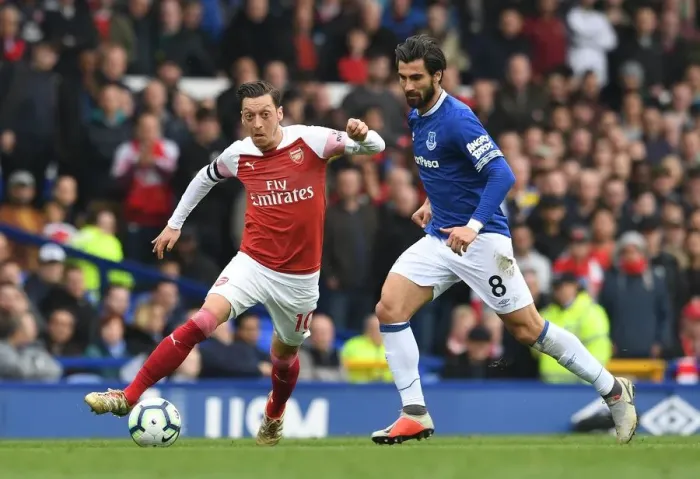 Framed Print : Mesut Ozil vs. Andre Gomes: Intense Battle at Goodison Park during Arsenal's Premier League Clash with Everton