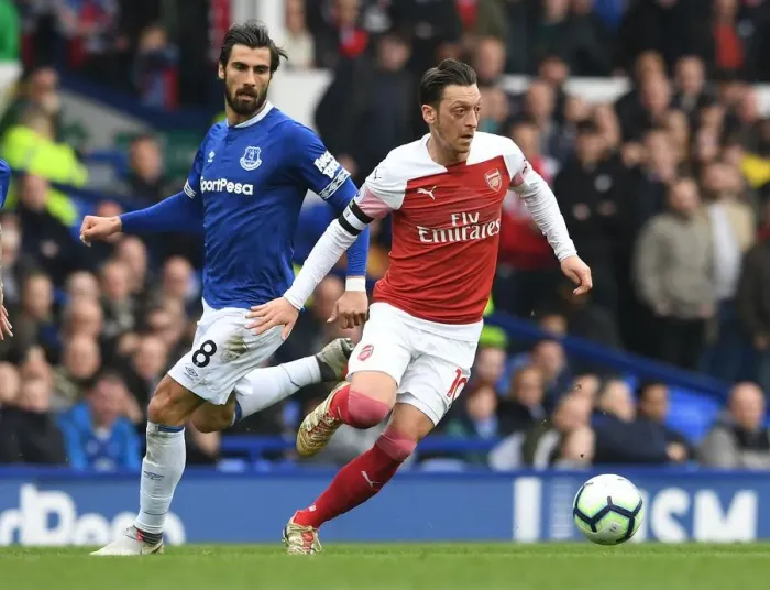 Framed Print : Mesut Ozil vs. Andre Gomes: A Premier League Showdown at Goodison Park