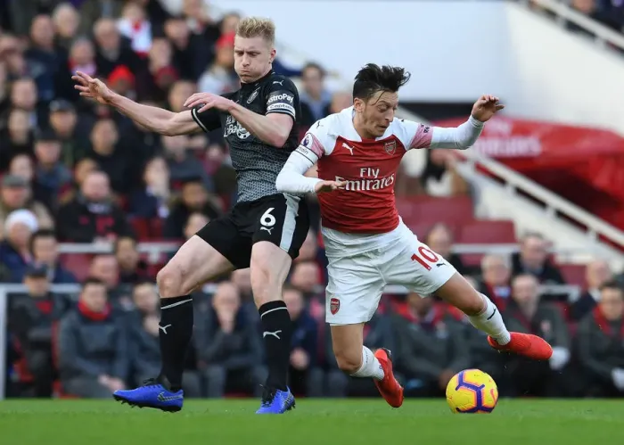 Framed Print : Mesut Ozil vs Ben Mee: Intense Battle at Arsenal's Emirates Stadium (Arsenal v Burnley 2018-19) Framed Print : Mesut Ozil vs Ben Mee: Intense Battle at Arsenal's Emirates Stadium (Arsenal v Burnley 2018-19)