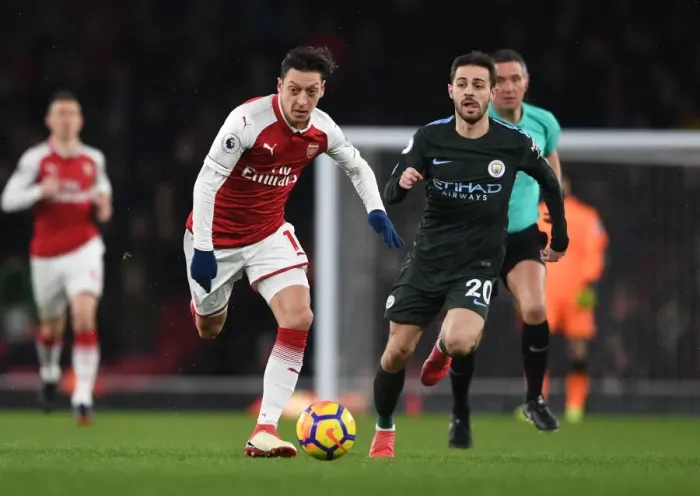 Framed Print : Mesut Ozil vs Bernardo Silva: A Premier League Battle at Arsenal's Emirates Stadium Framed Print : Mesut Ozil vs Bernardo Silva: A Premier League Battle at Arsenal's Emirates Stadium