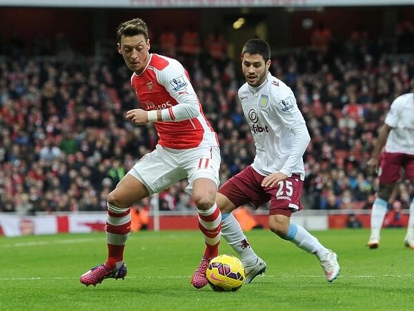 Mesut Ozil vs. Carles Gil: Intense Battle at the Emirates - Arsenal v Aston Villa, Premier League 2014-15