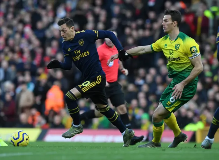 Framed Print : Mesut Ozil vs. Christoph Zimmermann: Battle at Carrow Road - Norwich City vs. Arsenal FC, Premier League 2019-20