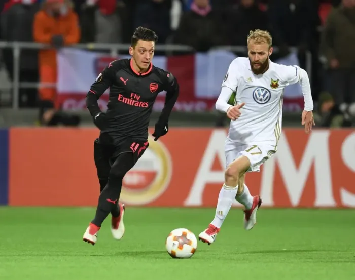 Framed Print : Mesut Ozil vs. Curtis Edwards: Arsenal's Europa League Clash with Ostersunds FK Framed Print : Mesut Ozil vs. Curtis Edwards: Arsenal's Europa League Clash with Ostersunds FK