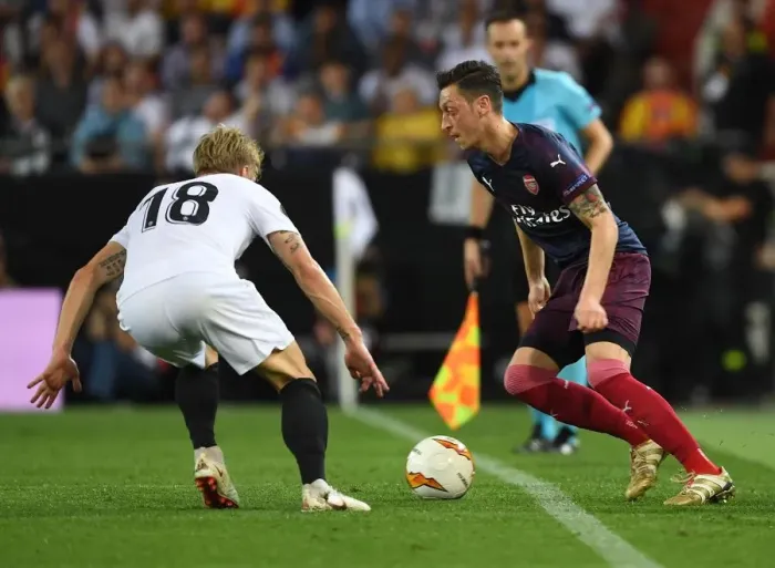 Framed Print : Mesut Ozil vs. Daniel Wass: Arsenal's Europa League Semi-Final Battle at Valencia