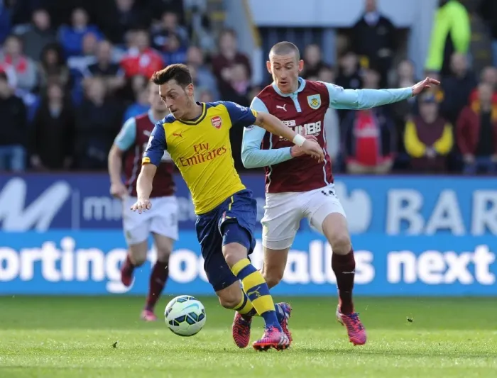 Framed Print : Mesut Ozil vs. David Jones: A Premier League Battle at Turf Moor (2015)