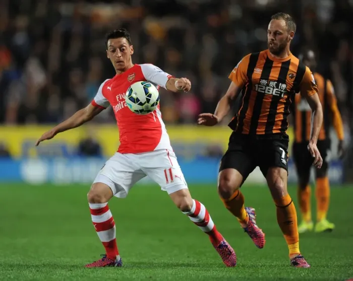 Framed Print : Mesut Ozil vs David Meyler: Intense Battle at KC Stadium, Hull City vs Arsenal, Premier League 2014 / 15 Framed Print : Mesut Ozil vs David Meyler: Intense Battle at KC Stadium, Hull City vs Arsenal, Premier League 2014 / 15