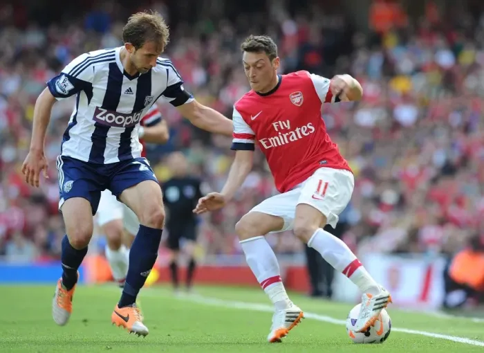 Framed Print : Mesut Ozil vs Diego Lugano: Arsenal vs West Bromwich Albion, Premier League Showdown (2013-14)